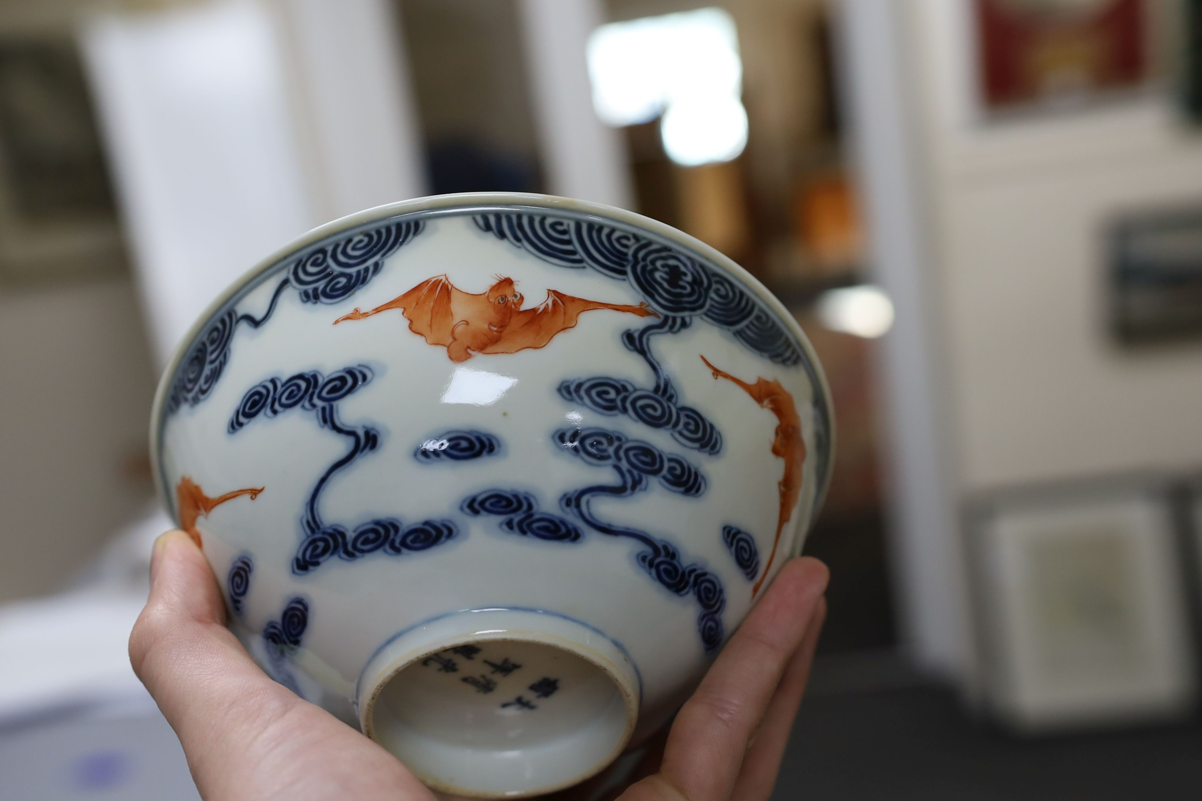 A pair of Chinese iron red and underglaze blue ‘five bat’ bowls, Guangxu mark and probably of the period (1875-1908), 16.5cm diameter